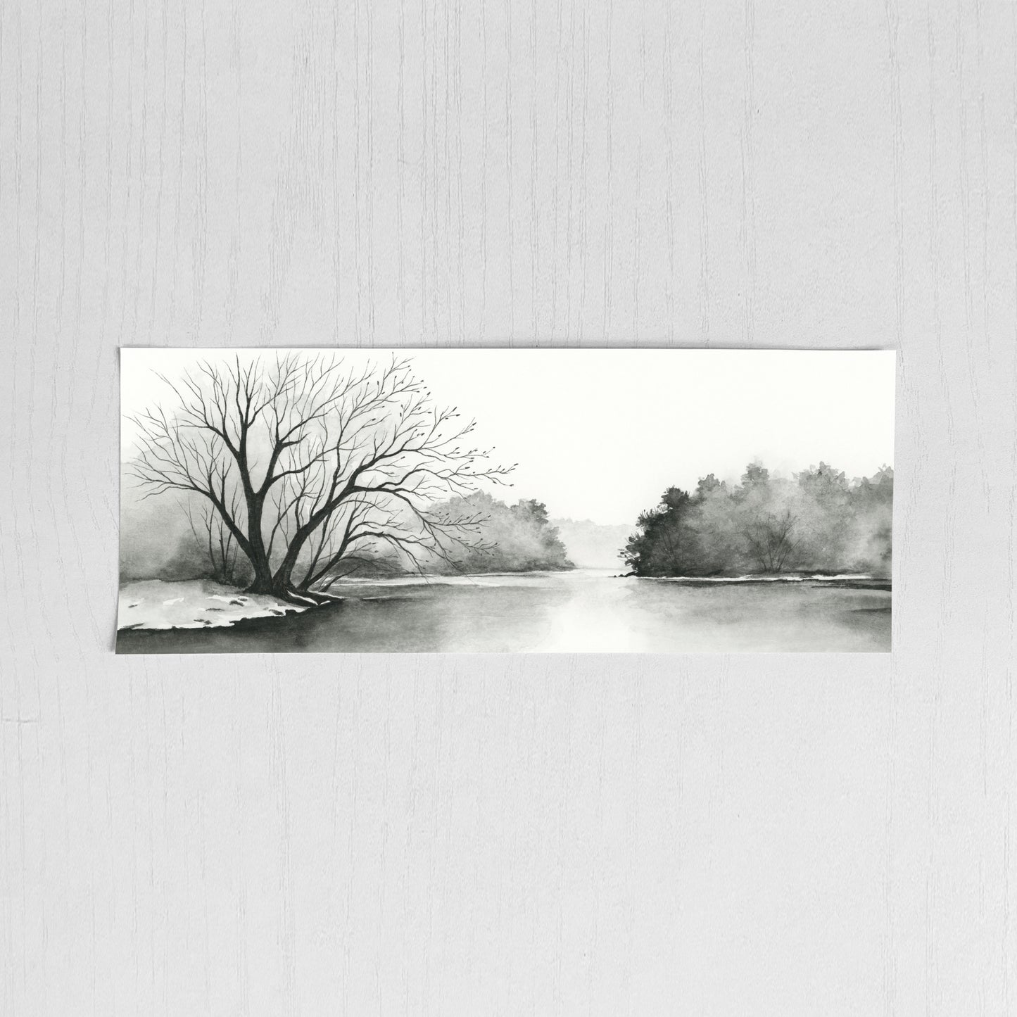Black and white landscape painting of a river with trees on a textured wall.